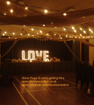 Couple dancing in front of stage